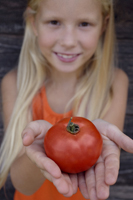 girl holding tomato - Alex Mares-Manton