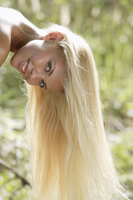 Young woman hanging long blond hair - Alex Mares-Manton