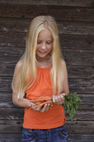 girl with bunch of carrots - Alex Mares-Manton