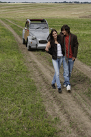 Young couple walking away from car - Alex Mares-Manton
