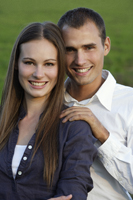 Portrait of smiling young couple - Alex Mares-Manton
