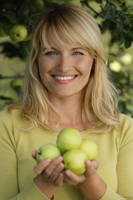 woman with apples under apple tree - Alex Mares-Manton