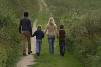 family walking down country road - Alex Mares-Manton