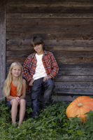 boy and girl with pumpkin - Alex Mares-Manton