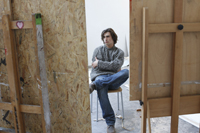 artist sitting in studio - Dennison Bertrand