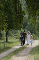 family walking down country road - Alex Mares-Manton