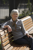 senior woman sitting on bench - Alex Mares-Manton