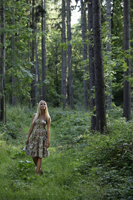 Young blond woman walking in forest - Alex Mares-Manton