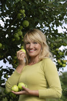 woman with apples under tree - Alex Mares-Manton