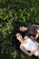 Young couple lying in field - Alex Mares-Manton