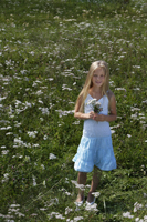 little girl with bouquet in meadow of flowers - Alex Mares-Manton
