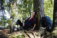 Young woman resting under tree - Alex Mares-Manton