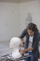 artist working on bust - Dennison Bertrand