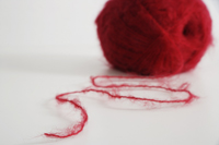 ball of red yarn - Ellery Chua