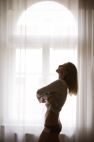 Profile of woman undressing - Alex Mares-Manton