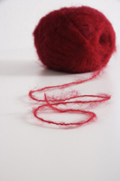 Ball of red yarn - Ellery Chua