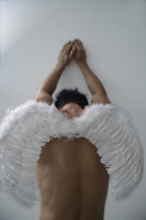Man wearing angel wings - Nugene Chiang