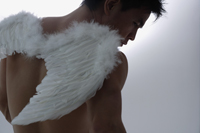 Man wearing angel wings - Nugene Chiang