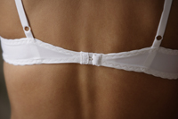 Close up of woman's back, wearing bra strap - Alex Mares-Manton