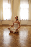 Young woman doing yoga - Alex Mares-Manton