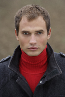 Portrait of man wearing red sweater - Alex Mares-Manton