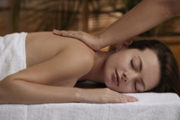 Young woman having massage - Nugene Chiang