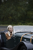 senior woman driving antique car - Alex Mares-Manton