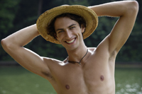 Young man wearing hat, smiling - Nugene Chiang