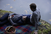 Young couple picnicking lakeside - Alex Mares-Manton