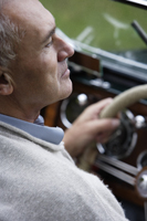 Profile of senior man driving car - Alex Mares-Manton