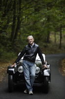 Senior man leaning against antique car - Alex Mares-Manton