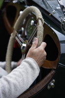 Senior man's hands on steering wheel of car - Alex Mares-Manton