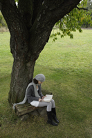 young woman reading under tree - Alex Mares-Manton