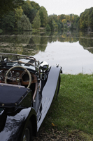 antique car sitting lakeside - Alex Mares-Manton