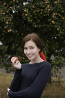Young woman with apple - Alex Mares-Manton
