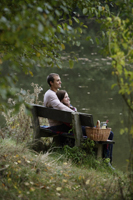 Young couple picnicking lakeside - Alex Mares-Manton