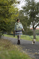 Young woman walking dog - Alex Mares-Manton