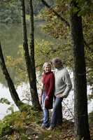 Senior couple standing in woods - Alex Mares-Manton