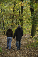 Senior couple walking through woods - Alex Mares-Manton