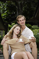 couple enjoying coffee on steps - Alex Mares-Manton