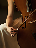 close up of woman playing cello - Alex Hajdu