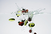 fruits in water (strawberries, lime slices, grapes, blueberries) - Nugene Chiang
