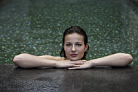 woman resting chin on hands, inside pool - Alex Mares-Manton