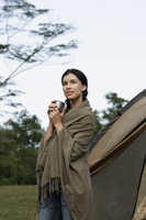 Young woman camping - Nugene Chiang