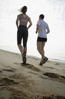 couple running on beach - Nugene Chiang