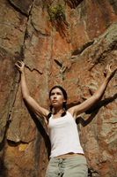 Young woman rock climbing - Nugene Chiang