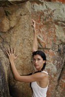 Young woman on rock climb - Nugene Chiang
