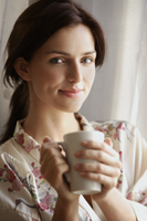 young woman enjoying morning coffee - Alex Mares-Manton
