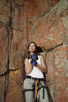 Young woman rock climbing - Nugene Chiang