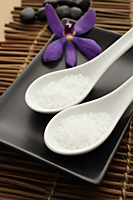 Close up of salt in spoons for spa. - Nugene Chiang
